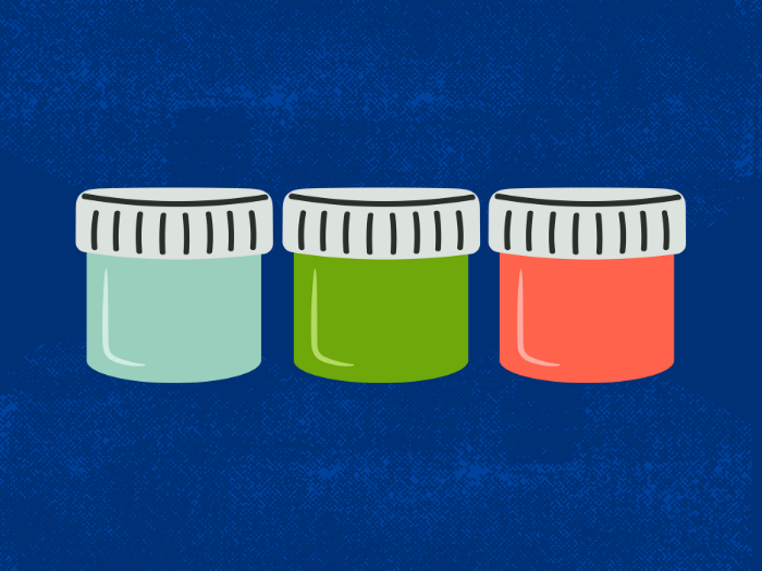Three jars of paint with a blue background