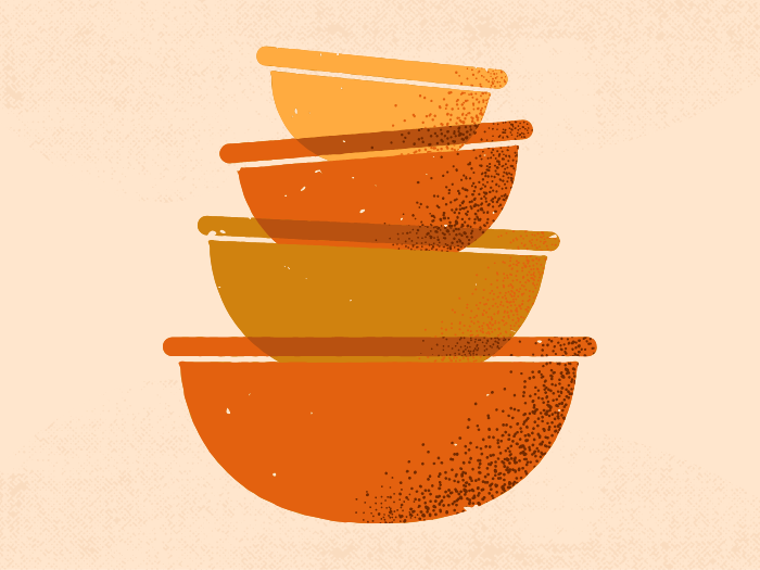 a stack of yellow and orange bowls