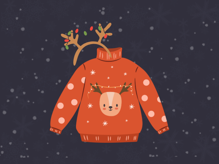 orange sweater with a reindeer on it and a headband with a pair of antlers attached