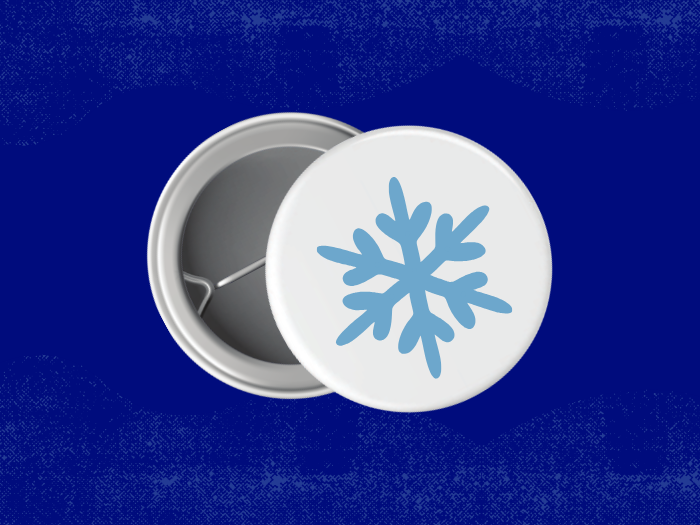 a pin button with a snowflake on it
