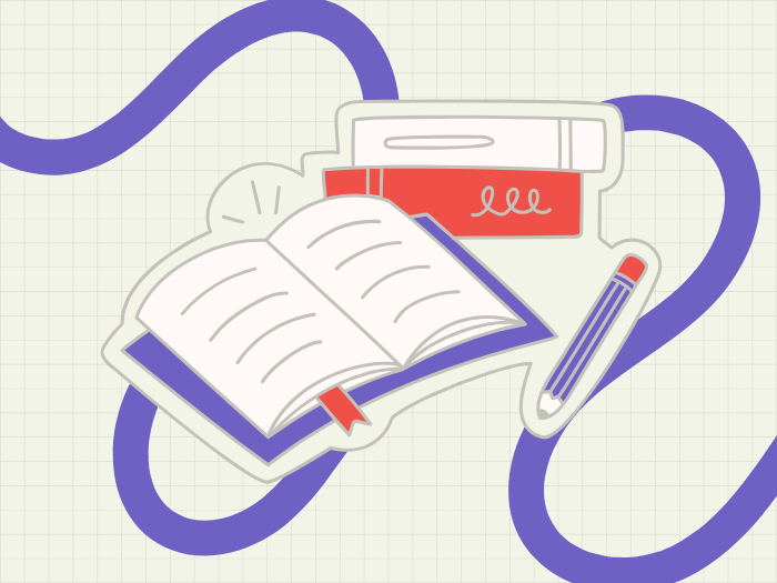 an open book with two books stacked behind it